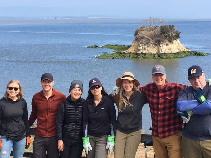 Coworkers at a beach cleanup.