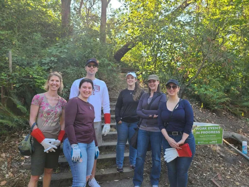 Coworkers at a park cleanup.