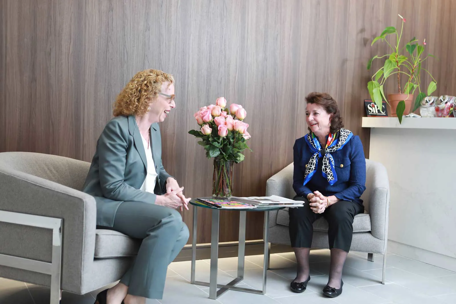 Two women discussing a report.