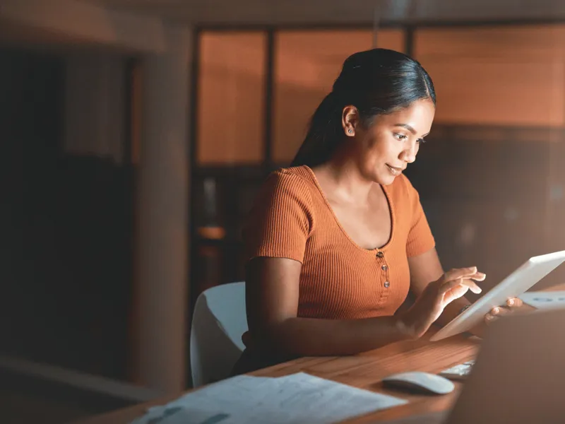 Woman working on a tablet.