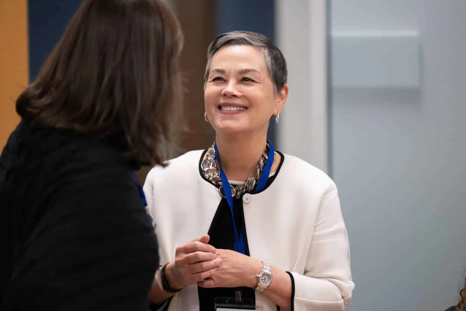 Woman talking with a co-worker.