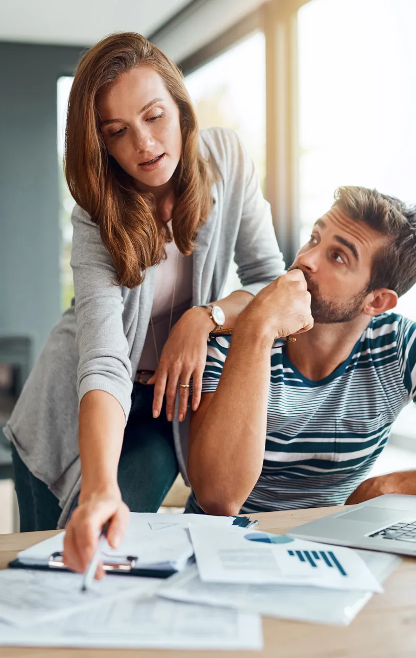 Couple discussing a budget.