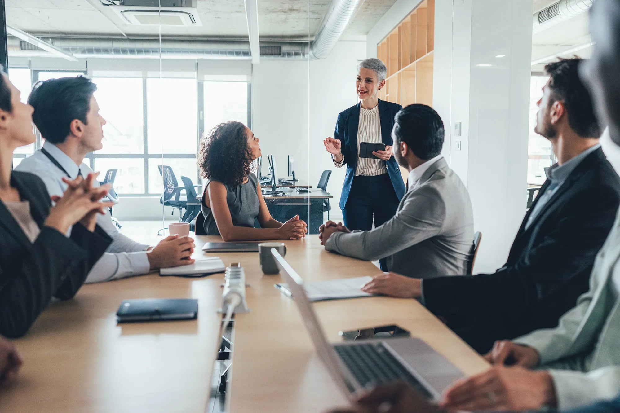 A leader speaks to a collaborative team.