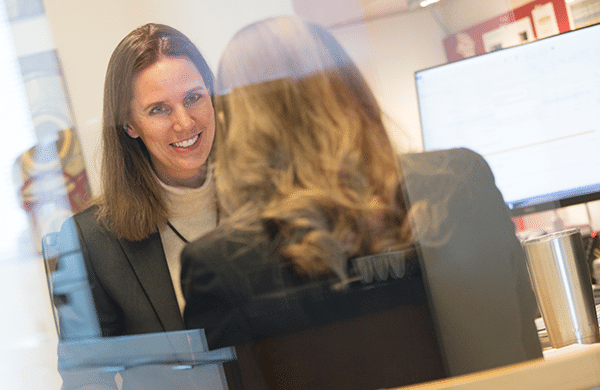 Woman smiling with her coworker.