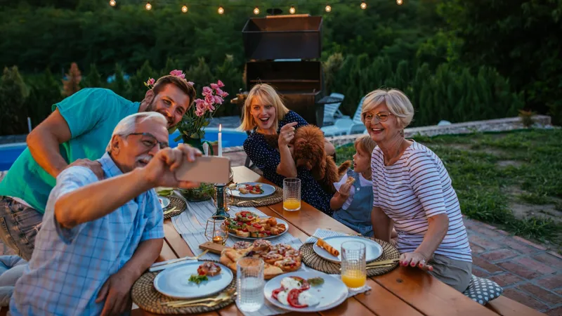 Family taking a selfie at dinner.